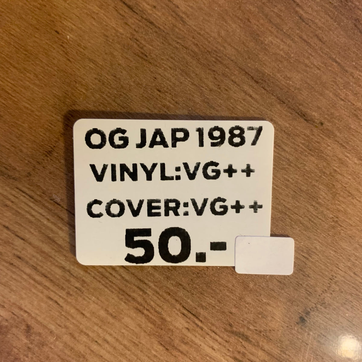 Disque vinyle et inscription Somewhere on Tour 87